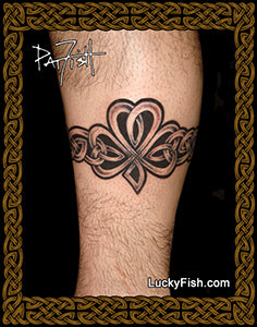 Tattoo of a Celtic knot shamrock design on a person's leg with 'Lucky Fish' branding.
