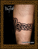 Tattoo of a Celtic shamrock and armband knot design on a person's leg with 'Lucky Fish' branding.