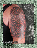 Celtic knot tattoo on a person's arm with LuckyFish.com branding.
