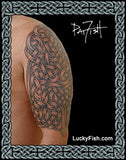 Celtic knot tattoo by Pat Fish on a person's arm with 'Lucky Fish' branding.