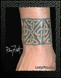 Tattoo on a wrist with intricate Celtic knot design, branded 'Lucky Fish' 