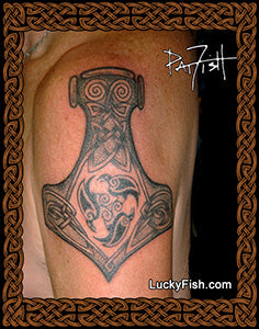 Tattoo of a Viking axe design on a person's arm with 'Lucky Fish' branding.