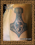 Tattoo of a Thor's hammer design on skin with 'Lucky Fish' branding.