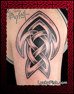 Tattoo of a Celtic knot design of an arrowhead on a person's arm with Lucky Fish branding.
