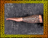 Tattoo design of Pictish key pattern on a person's arm with 'LuckyFish.com' branding.