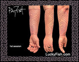 Tattoo first session progress on a person's arm with 'Lucky Fish' branding and Pictish geometric key pattern