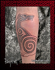Tattoo of a stylized Irish Wolfhound Celtic dog design on a person's leg with a luckyfish.com branding