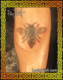 Tattoo of a Celtic bee design on leg by Pat Fish of LuckyFish.com