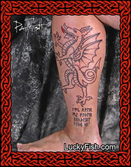 Tattoo of a dragon design on a person's leg with 'Lucky Fish.com' branding.