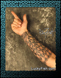 Intricate Celtic knot tattoo design by Pat Fish on arm with  'Lucky Fish' branding.