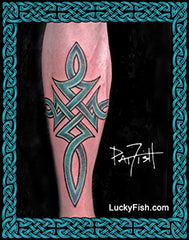 Celtic cross tribal tattoo design on a person's leg with 'Lucky Fish' branding.
