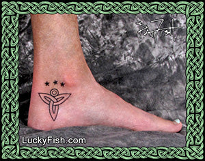 Ankle with a Celtic angel tattoo of a star and circle design, framed by Celtic knotwork.