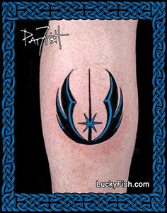A  tattoo of the Star Wars Jedi Knight symbol, featuring black and blue flame-like shapes with a central vertical line and star, applied to leg calf and framed in photo by a Celtic knot border.