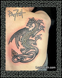 Tattoo of a dragon design on a person's upper back with 'Lucky Fish' branding.
