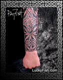 Celtic tattoo sleeve knot design on a forearm with 'Lucky Fish' branding.