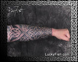 Tattooed arm with intricate full sleeve Celtic  design by Pat Fish featuring Lucky Fish branding.