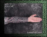 Tattooed arm sleeve with intricate Celtic knot design by Pat Fish featuring LuckyFish.com branding.
