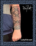 Tattoo design Celtic sleeve by Pat Fish on a person's arm with 'Lucky Fish' branding.