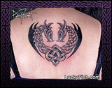 Tattoo of two interlocking Celtic Norse dragons forming a heart on a person's back, with 'Lucky Fish' branding.