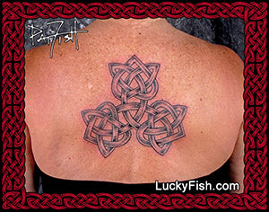 Person with a Celtic knot tattoo on their back, three Celtic hearts joined together with 'LuckyFish.com' branding.