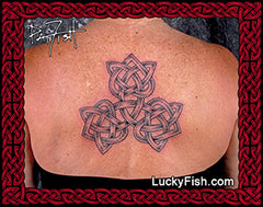 Person with a Celtic knot tattoo on their back, three Celtic hearts joined together with 'LuckyFish.com' branding.