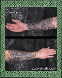 Two views of a tattooed arm with intricate dog tattoo designs, framed by Celtic knotwork, by Pat Fish