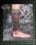 Celtic tattoo design filling lower leg by Pat Fish, with 'LuckyFish.com' branding.