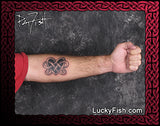 Tattoo of a Celtic heart knot design on a person's arm with Lucky Fish branding.