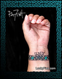 Hand with a Celtic knot bracelet tattoo and name by LuckyFish Tattoo