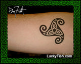 Tattoo of a Celtic knot design by Pat Fish on a forearm with Lucky Fish branding.