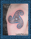 Tattoo of a triangular triskle Celtic knot design on a shoulder with PatFish and LuckyFish branding