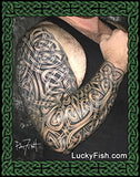 Tattoo of a Celtic design on a person's full sleeve arm with Lucky Fish branding.