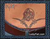 Tattoo of a Celtic knot heart design on skin of lower back with 'Lucky Fish' branding.