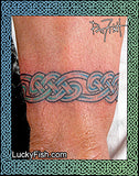 Celtic knot tattoo on a person's arm with 'Lucky Fish' branding.