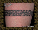 Tattoo of a Celtic knot design on skin with Lucky Fish branding.