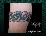 Celtic knot tattoo on a person's arm with 'Lucky Fish' branding.
