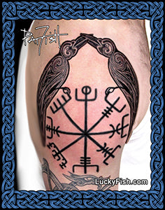 Tattoo of a Viking symbol vegvisir and two ravens on a person's arm with 'Lucky Fish' branding.