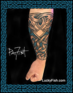 Tattoo forearm sleeve with intricate Nordic dragon patterns, featuring the brand 'Lucky Fish'.