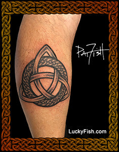 Celtic knot tattoo of triquetra and ring on a person's leg with 'Lucky Fish' branding.