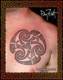 Triskele tattoo on a person's chest with 'Lucky Fish' branding.