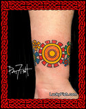 Colorful circular tattoo on a person's ankle with 'Lucky Fish' branding.