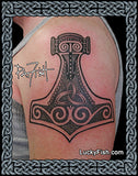 Tattoo of a Thor's hammer on a person's arm with 'Lucky Fish' branding.