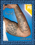 Tattooed arm with intricate designs on a blue background, featuring Lucky Fish branding.