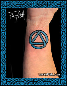 Tattoo of an Alcoholics Anonymous AA circle design on a wrist with Lucky Fish branding.