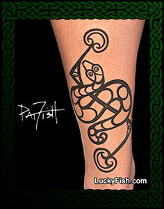 Tattoo of a Pictish Scottish snake design on a person's arm with 'Lucky Fish' branding.