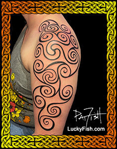 A black Pictish tribal-style spiral tattoo design shown on a person's upper arm, with the text LuckyFish.com and Pat Fish.