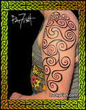 A close-up of a person's upper arm and shoulder showing a black Pictish tribal-style tattoo with swirling spiral patterns. With the signiture PatFish and branded LuckyFish.com
