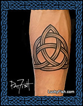 Celtic knot triquetra triangle tattoo on a person's arm with 'Lucky Fish' branding.