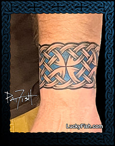 Celtic knot tattoo band on a wrist with 'Lucky Fish' branding.