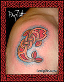Tattoo of a colorful fish design with Celtic knot patterns on a person's shoulder, tattoo by Pat Fish of Luckyfish.com